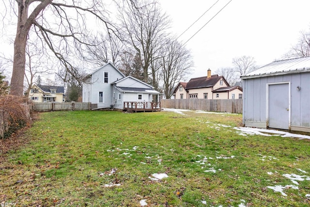 view of yard featuring a shed and a deck