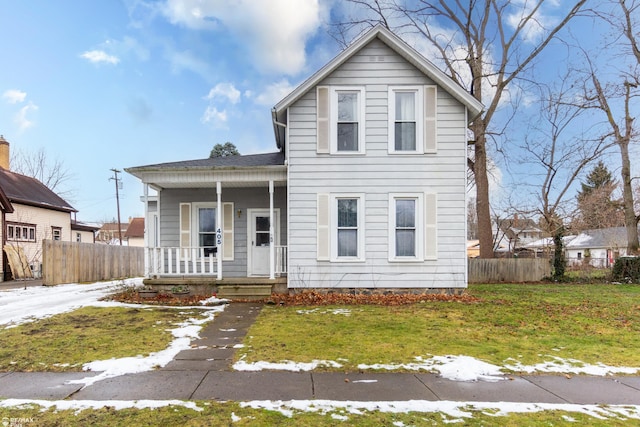 view of front property with a porch and a front yard