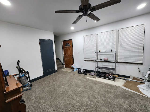 miscellaneous room with carpet flooring and ceiling fan