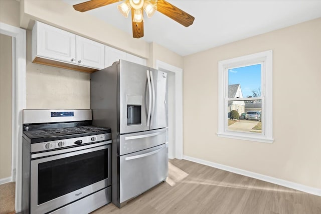 kitchen featuring ceiling fan, white cabinetry, light hardwood / wood-style flooring, and stainless steel appliances