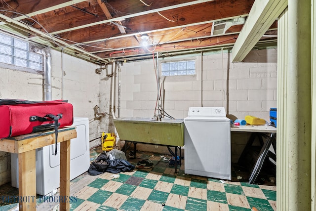 basement with independent washer and dryer and sink