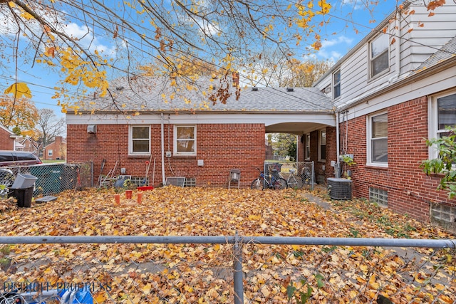 view of side of home with central AC unit