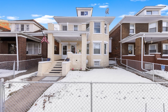 view of front of property featuring a balcony