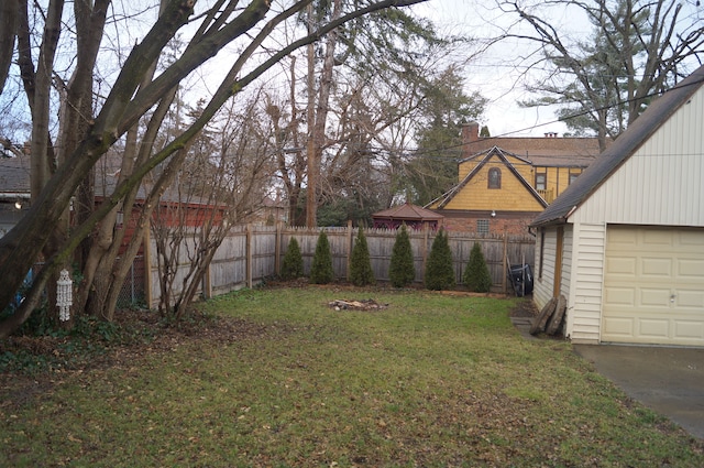 view of yard with a garage and an outdoor structure