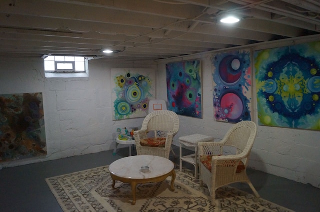 sitting room featuring concrete floors