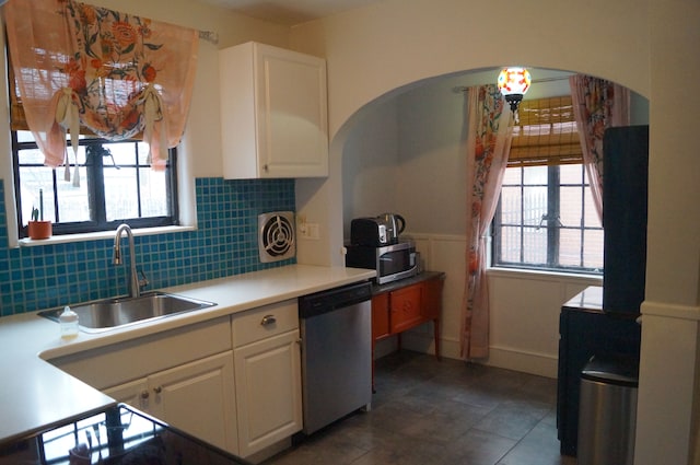 kitchen with white cabinets, appliances with stainless steel finishes, a wealth of natural light, and sink