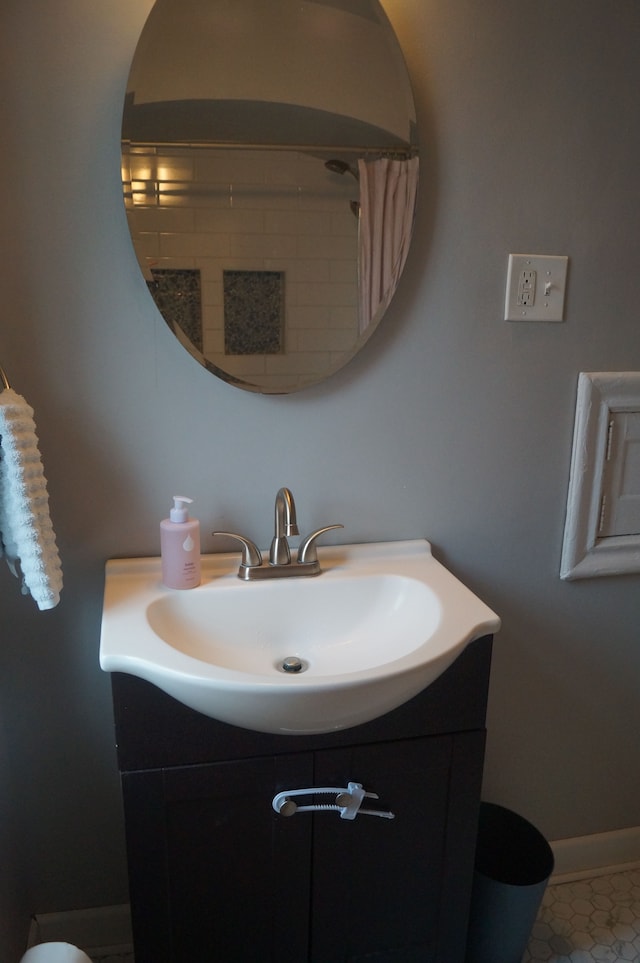 bathroom with tile patterned flooring and vanity