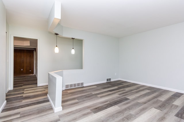 spare room featuring dark wood-type flooring