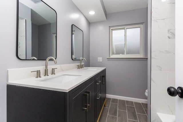 bathroom featuring vanity and toilet