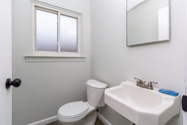 bathroom featuring sink and toilet