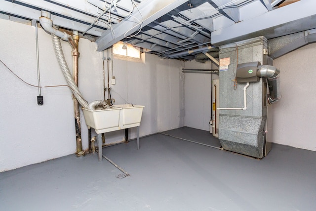 basement with heating unit and water heater