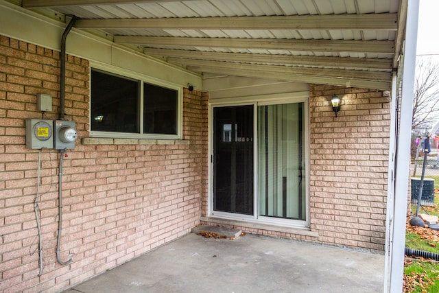 property entrance with a patio area