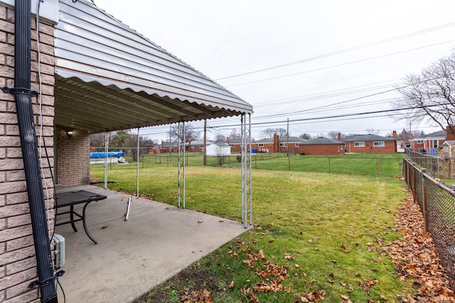 view of yard with a patio area and a trampoline