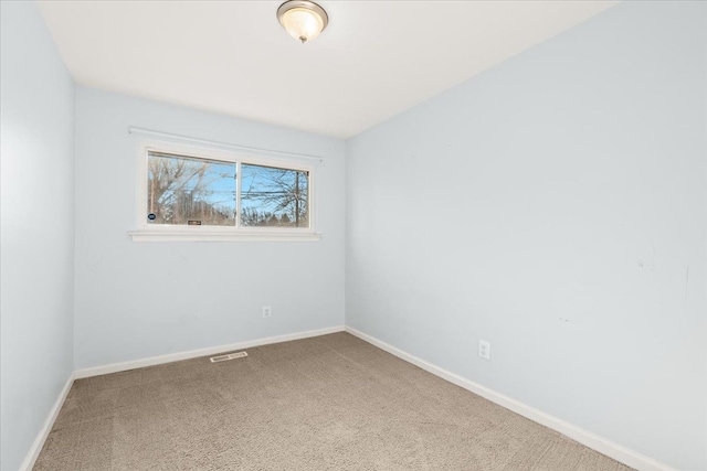 unfurnished room featuring carpet flooring