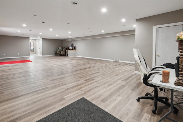 office with light hardwood / wood-style flooring