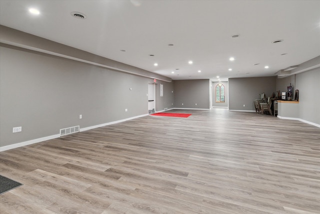 unfurnished living room with light hardwood / wood-style flooring