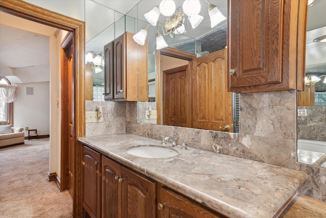 bathroom with vanity and decorative backsplash