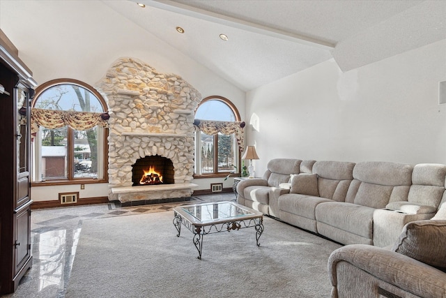 living room with a fireplace and high vaulted ceiling