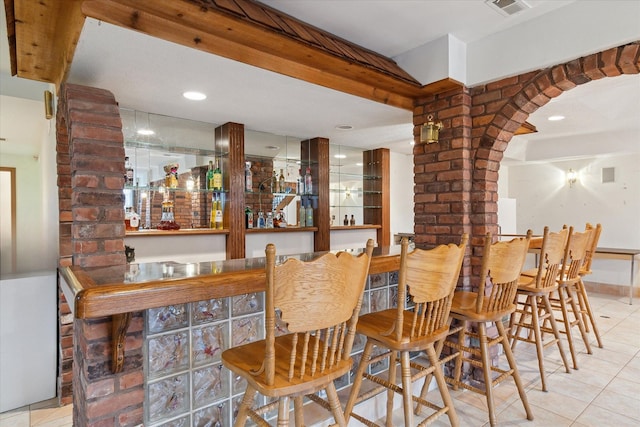 bar with light tile patterned flooring