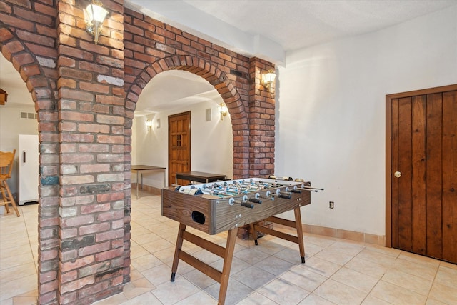 rec room featuring light tile patterned flooring