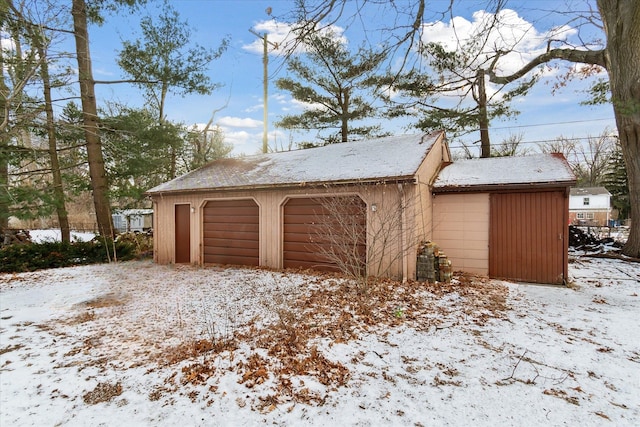 view of snow covered garage