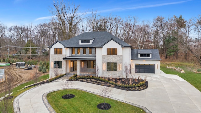 modern farmhouse style home featuring a porch, a garage, central air condition unit, and a front yard