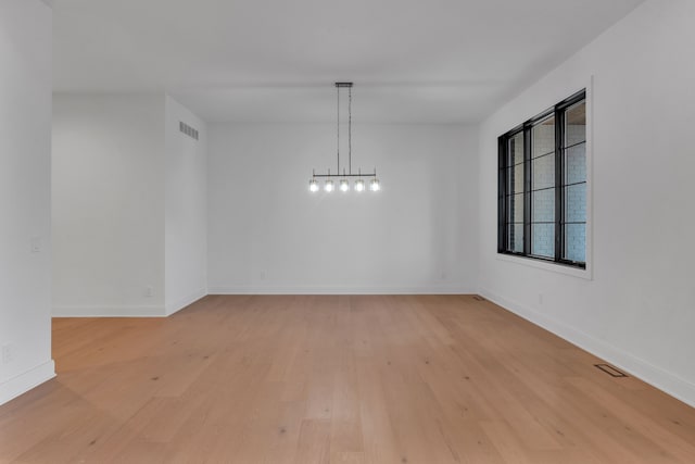 spare room with light wood-type flooring