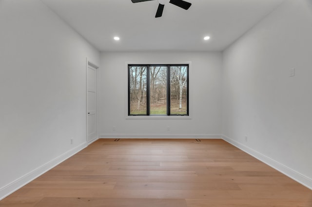 unfurnished room featuring ceiling fan and light wood-type flooring