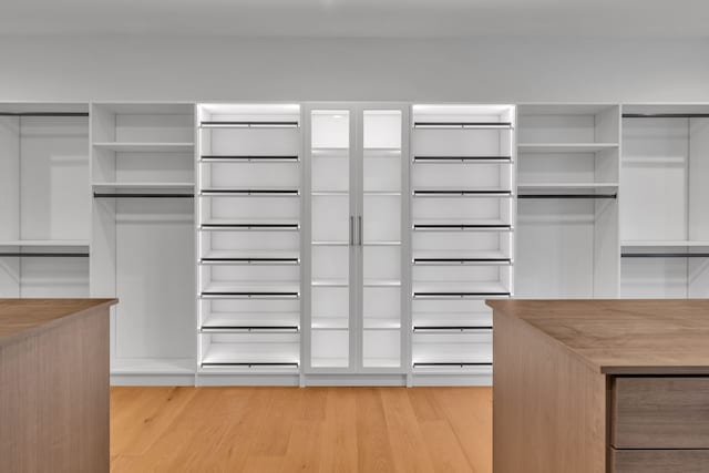 spacious closet featuring light wood-type flooring