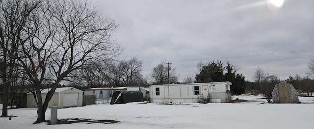 view of front of property featuring an outbuilding and a garage