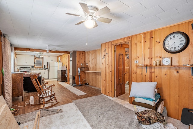 living room featuring light carpet and ceiling fan