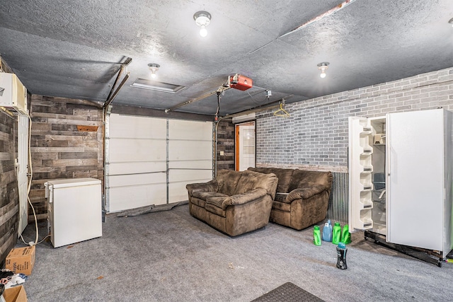 garage with a garage door opener and fridge