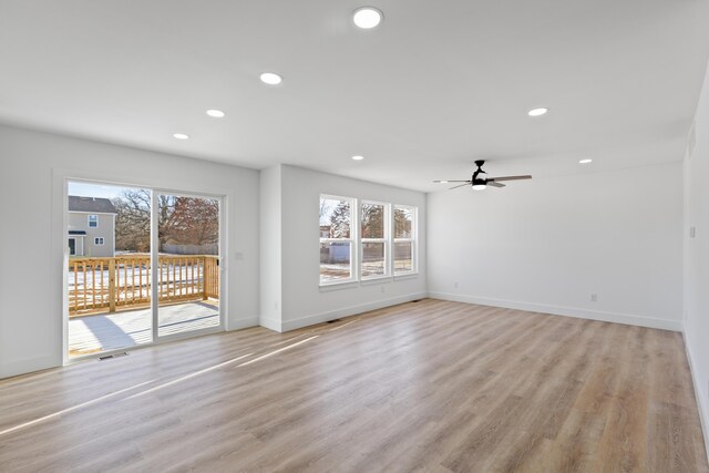 unfurnished living room featuring light hardwood / wood-style flooring and ceiling fan