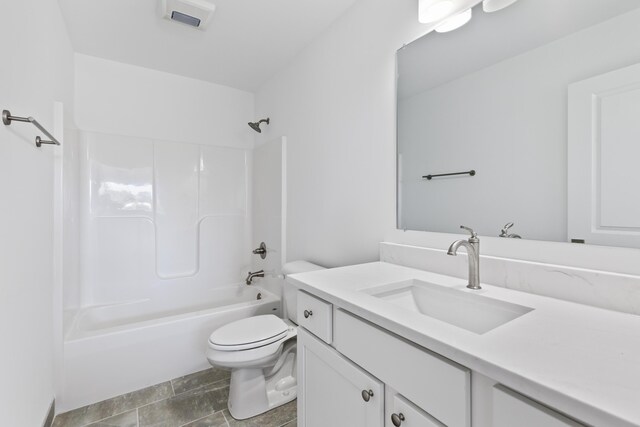 full bathroom with shower / tub combination, tile patterned flooring, vanity, and toilet