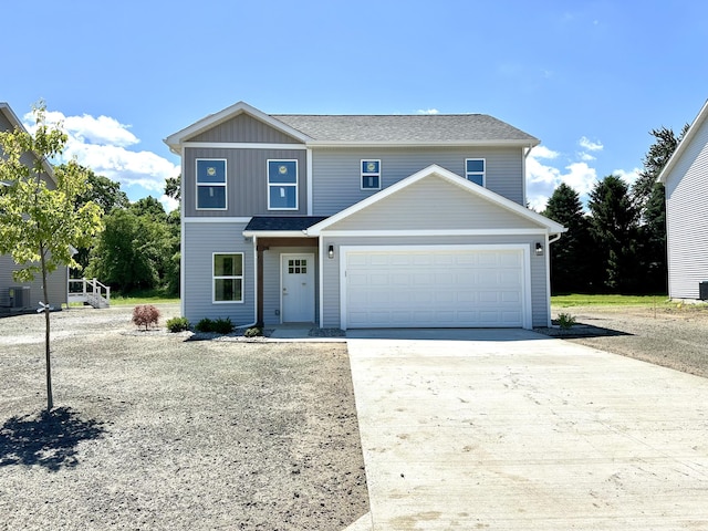 2011 Green Acres Dr, Adrian, MI 49221 - traditional-style house with concrete driveway and an attached garage