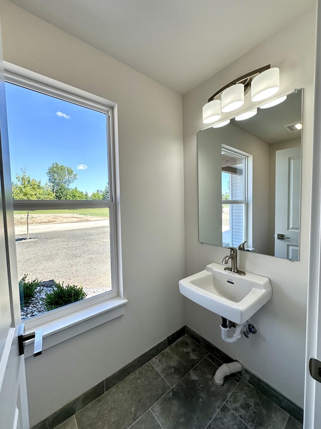 2011 Green Acres Dr, Adrian, MI 49221 - bathroom with baseboards and tile patterned floors