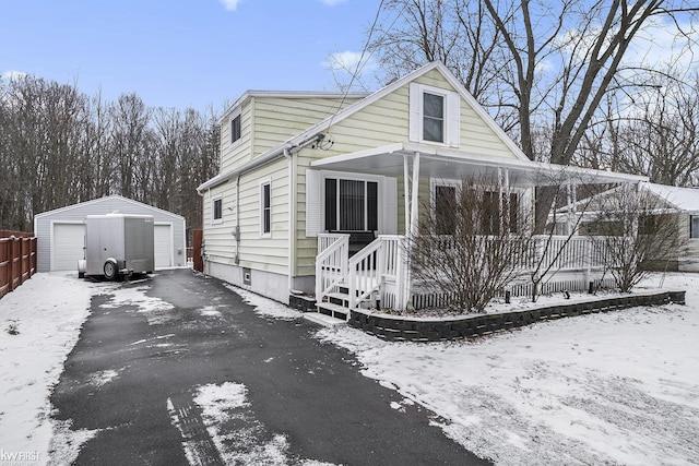 view of front facade with an outbuilding and a garage