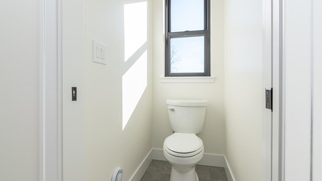 332 Arbor Ln, Saline, MI 48176 - bathroom with baseboards and toilet