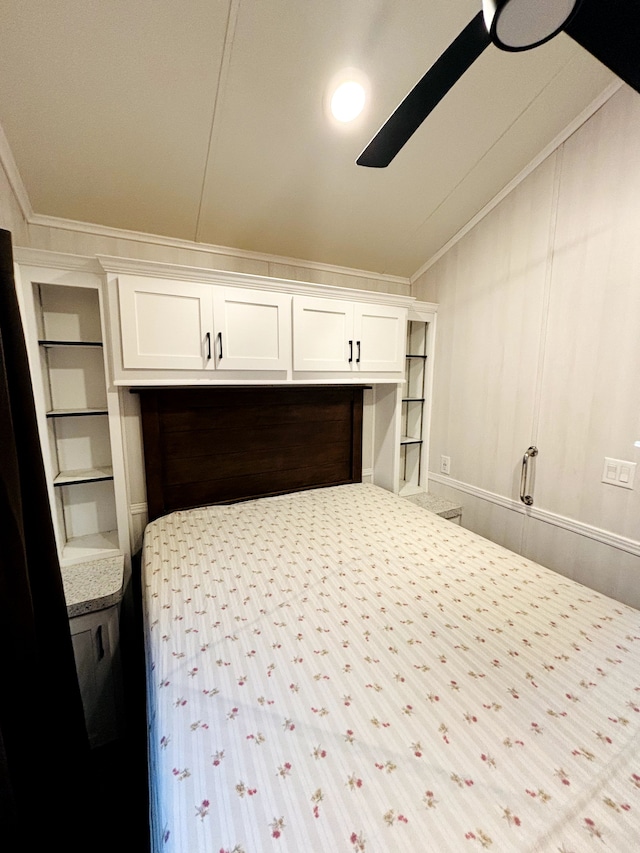 bedroom featuring ceiling fan and crown molding