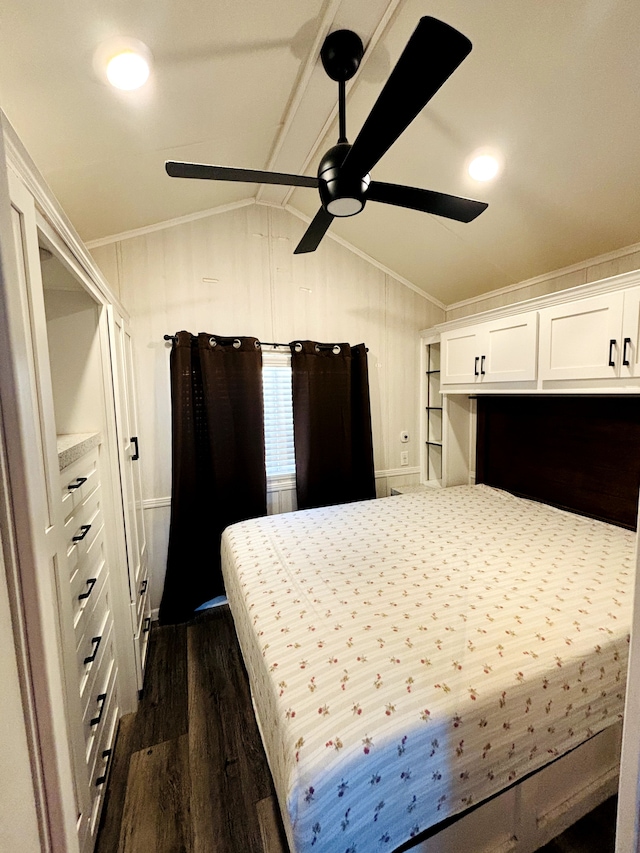 bedroom featuring ceiling fan, dark hardwood / wood-style floors, crown molding, and vaulted ceiling