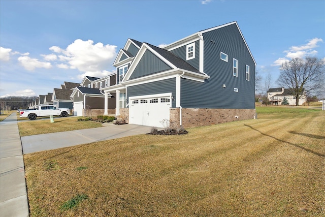 view of side of home with a garage and a lawn