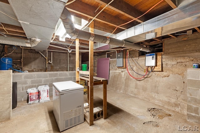 basement with electric panel and fridge