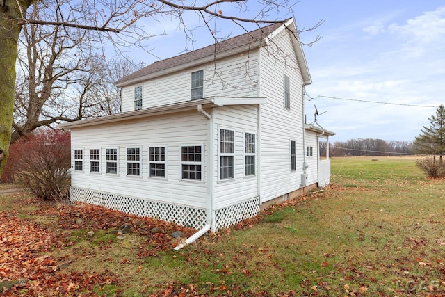 view of property exterior with a lawn