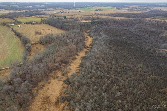 birds eye view of property with a rural view