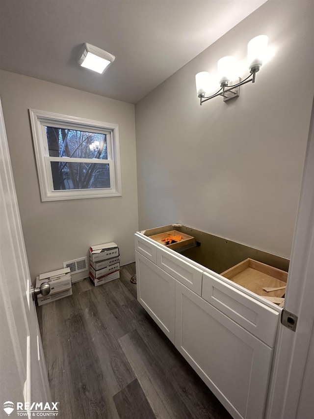 bathroom with hardwood / wood-style flooring