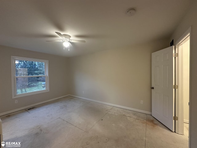 spare room with ceiling fan