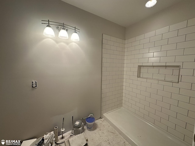 bathroom with tiled shower