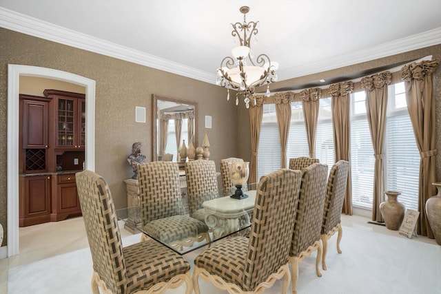 dining area with light colored carpet, crown molding, and a notable chandelier