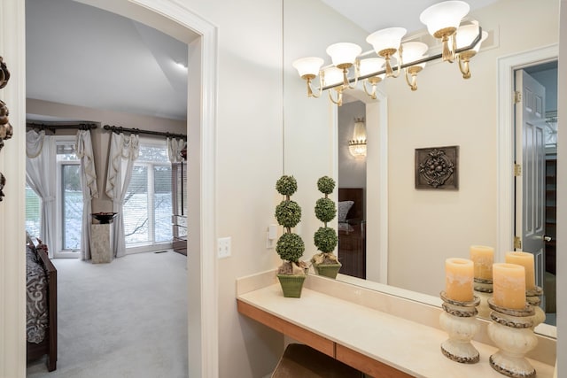 bathroom with a chandelier