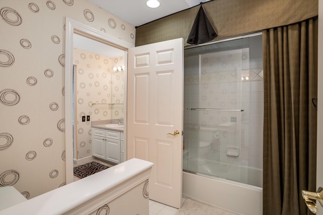 bathroom featuring vanity, tile patterned floors, and shower / bath combination with glass door